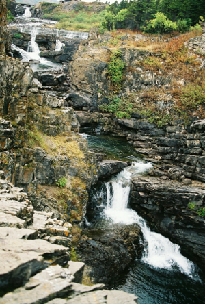 [There are at least four more sections of the falls beyond the ones described in the prior photo. Rather than one large falls, this one is a series of drops which meander back and forth down the hillside.]